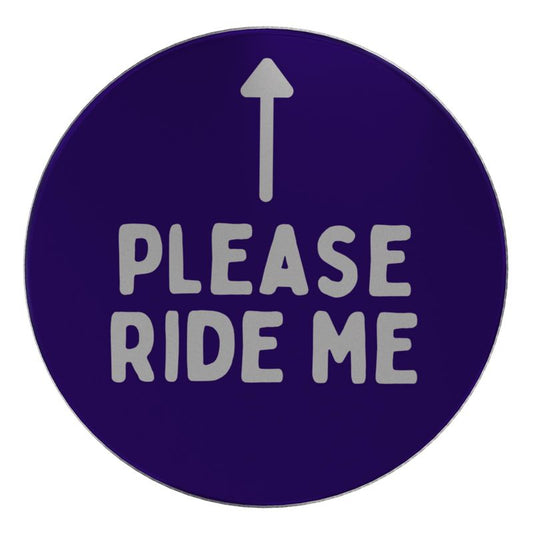 Round metal lid with arrow and "Please ride me" text