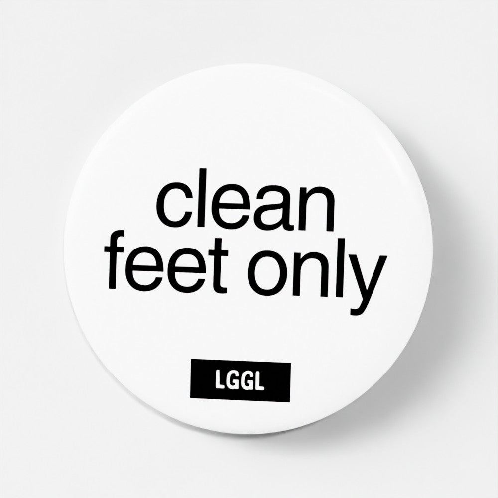 Pin badge with "Clean feet only" text