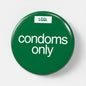 56mm gay fetish pin badge printed with "Condoms Only" - safe kink role badge