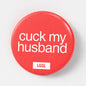 Pride badge with "cuck my husband" text