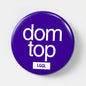 A blue fetish badge showing "dom top" text