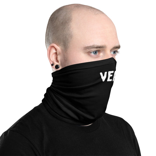 Gay person wearing a black neck gaiter with 'VERS'  on a white background