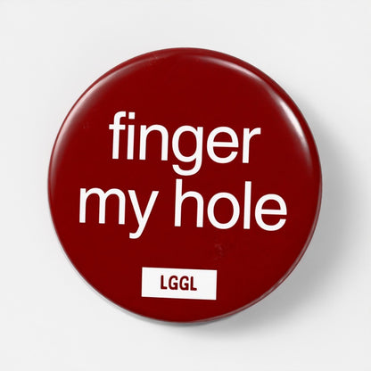 Gay assplay pin badge with "Finger My Hole" text - fingering fetish signal for cruising spots