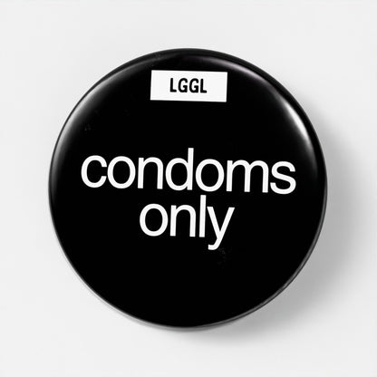 Let Go Get Laid black pin badge with statement "condoms only"