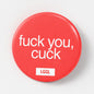 A red humiliating badge for a submissive cuckold