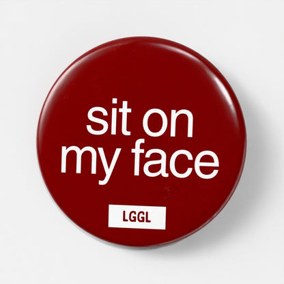 Gay facesitting pin badge with "Sit On My Face" text - face-riding kink signal, 56mm