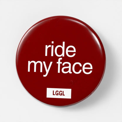 "Ride My Face" fetish pin - face-riding kink signal for darkrooms and cruising spots