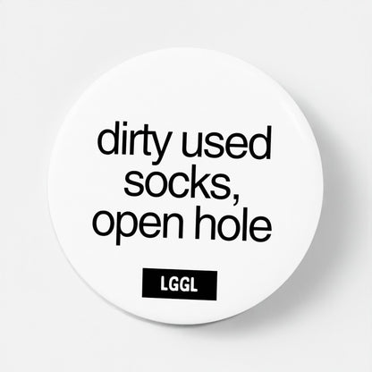 A pin badge featuring a statement about used dirty socks