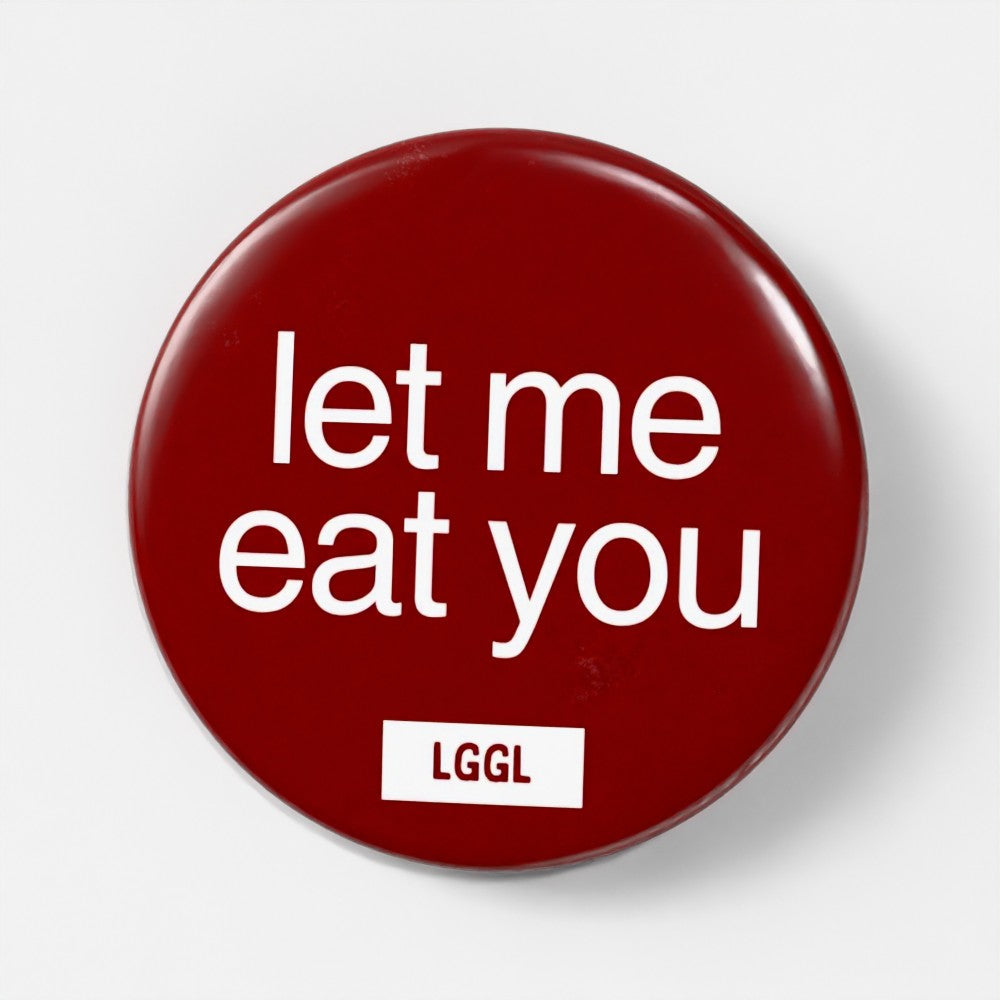 Gay pinback button featuring "let me eat you" sign for party