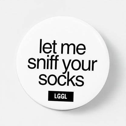 Pin badge featuring "Let me sniff your socks" pride accessory