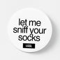 Pin badge featuring "Let me sniff your socks" pride accessory