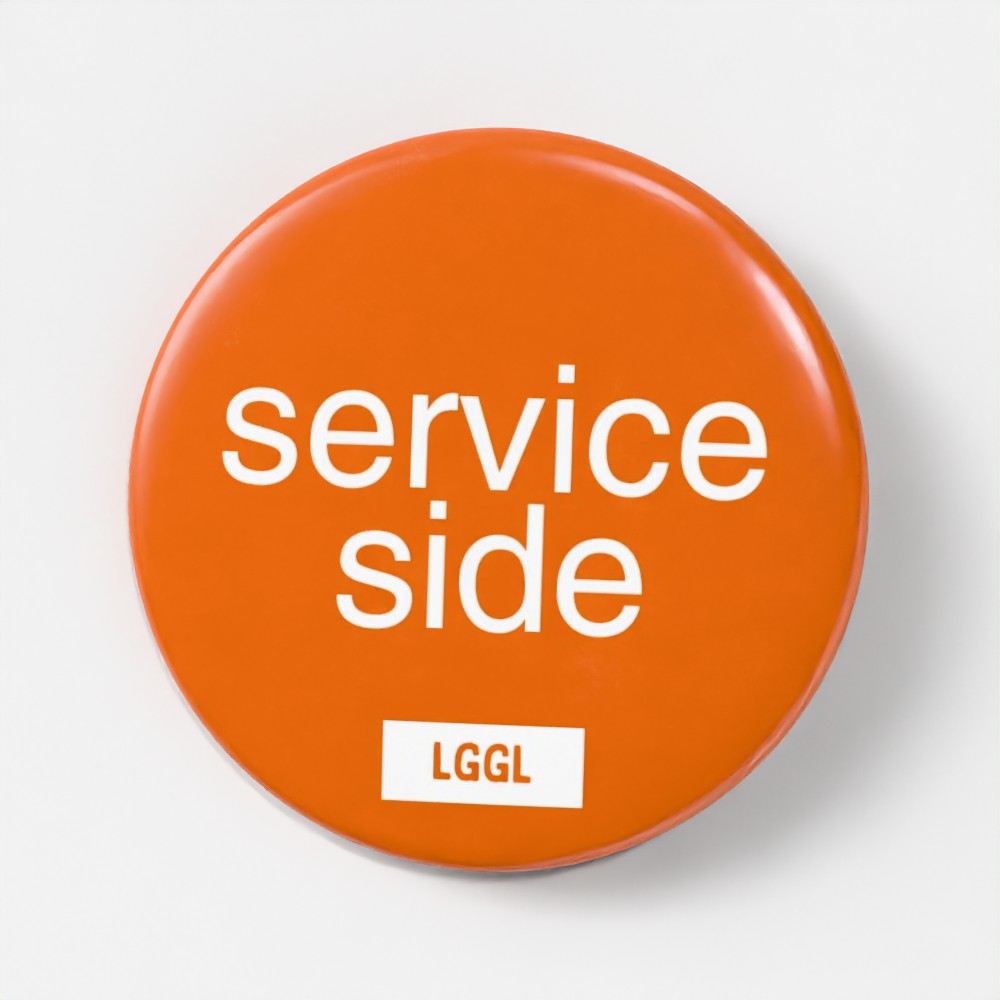 LetGoGetLaid 56mm pin badge featuring "Service Side" - gay oral and side play kink accessory