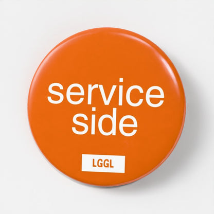 LetGoGetLaid 56mm pin badge featuring "Service Side" - gay oral and side play kink accessory