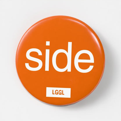 Orange 56mm pin badge printed with "Side" - gay side role kink badge by LetGoGetLaid