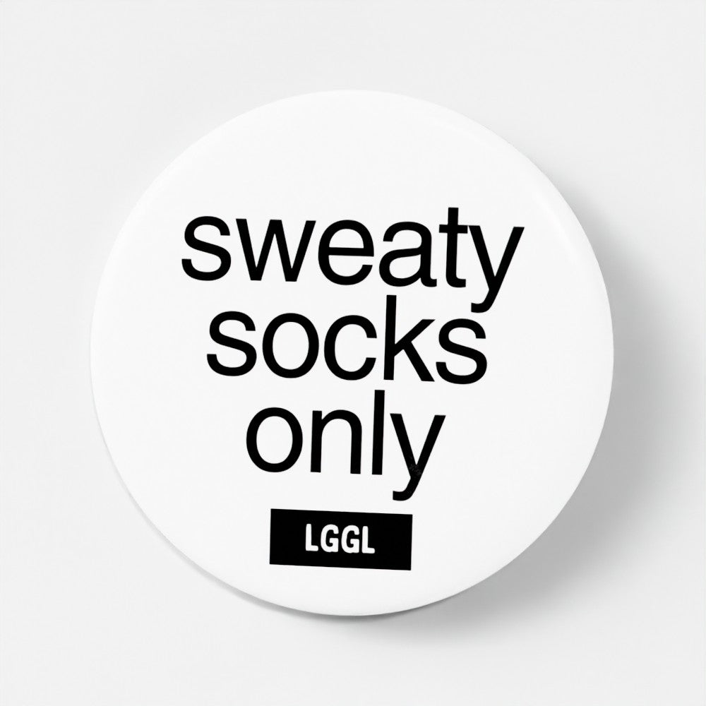 "Sweaty feet only" text shown on a round white pin badge