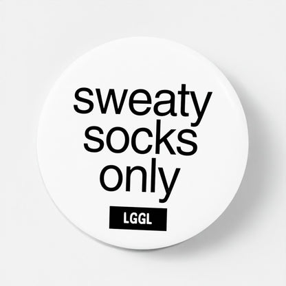 "Sweaty feet only" text shown on a round white pin badge