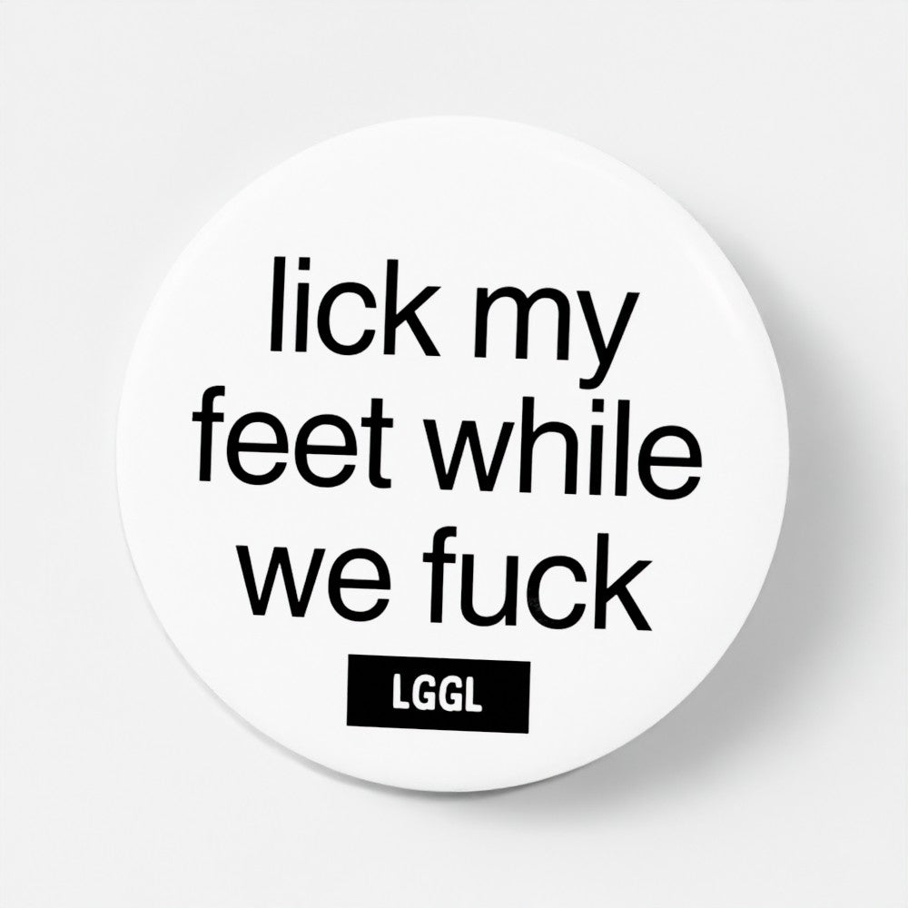 White pinback button featuring statements about licking feet