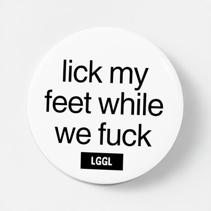 White pinback button featuring statements about licking feet