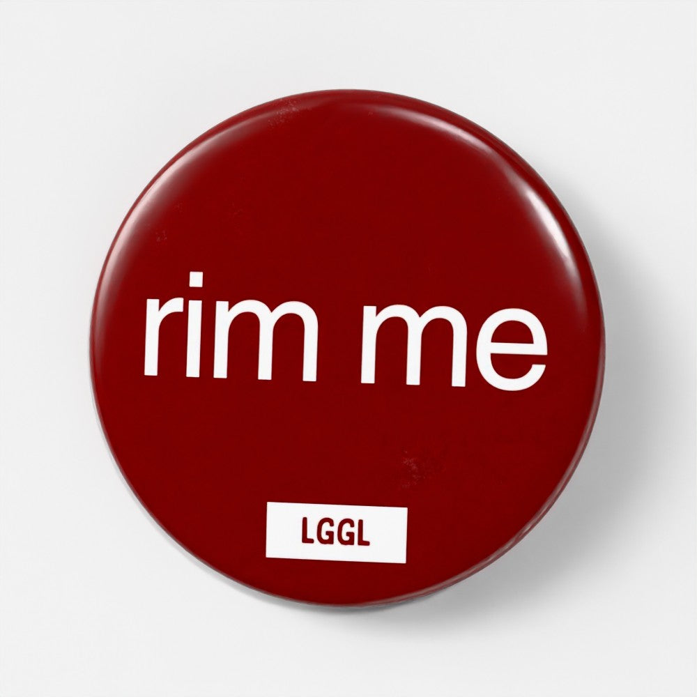 Party gear - a pin badge with "rim  me" text