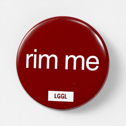Party gear - a pin badge with "rim  me" text