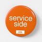 Gay pride accessory - pin button featuring "service side" text